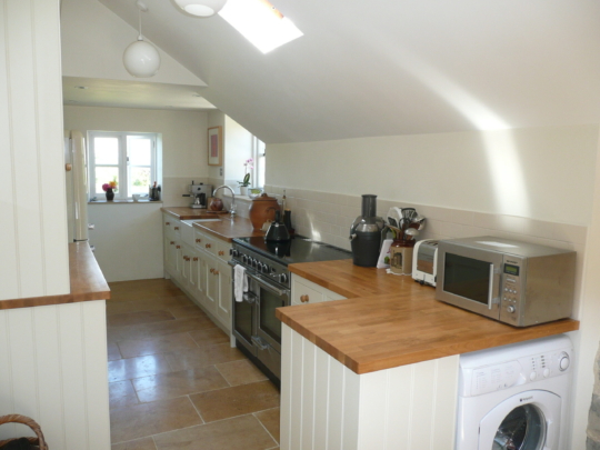 Painted tulipwood kitchen with oak worktops