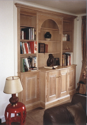 Limed oak breakfronted cupboards and display shelves