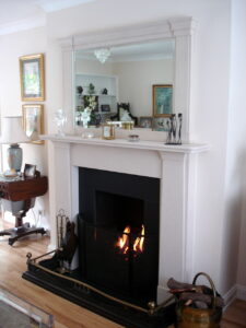 Over mantle mirror painted to matck limestone fire surround