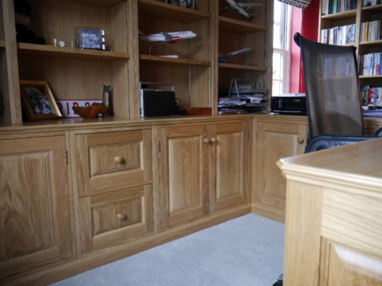 Oak panelled workstation and display shelves