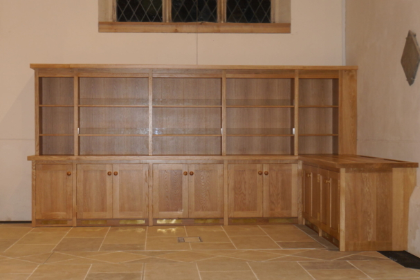 Oak display shelves and cupboard storage for a large Wiltshire church