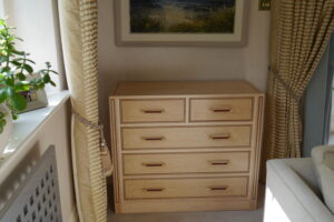 Birdseye maple and walnut chest of drawers