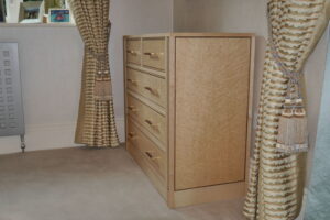 Birdseye maple and walnut chest of drawers