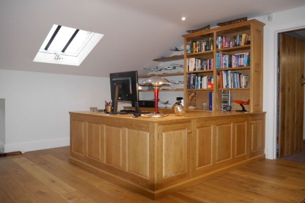 Oak panelled workstation and display shelves. New barn conversion installation