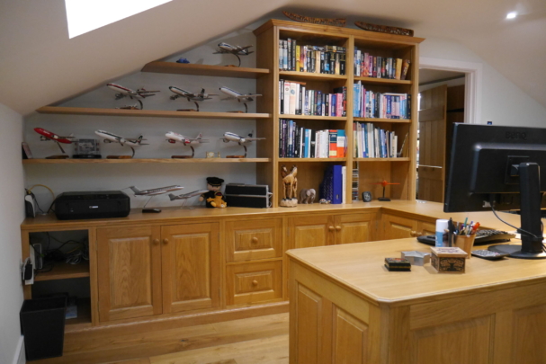 Oak panelled workstation and display shelves. New barn conversion installation