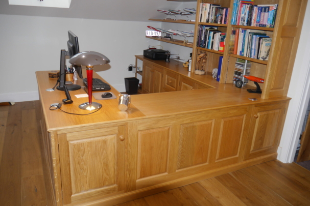 Oak panelled workstation and display shelves. New barn conversion installation